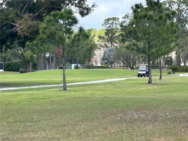 view of home's community featuring a lawn