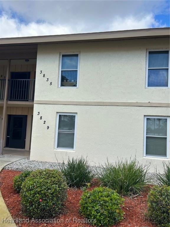 exterior space featuring stucco siding