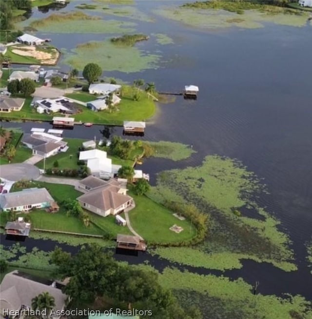 birds eye view of property featuring a residential view and a water view