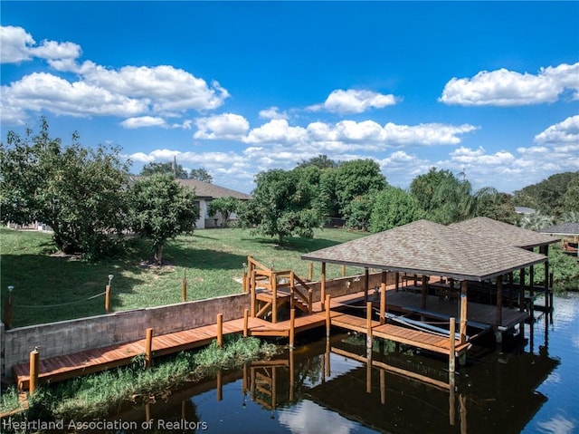 dock area featuring a water view and a yard