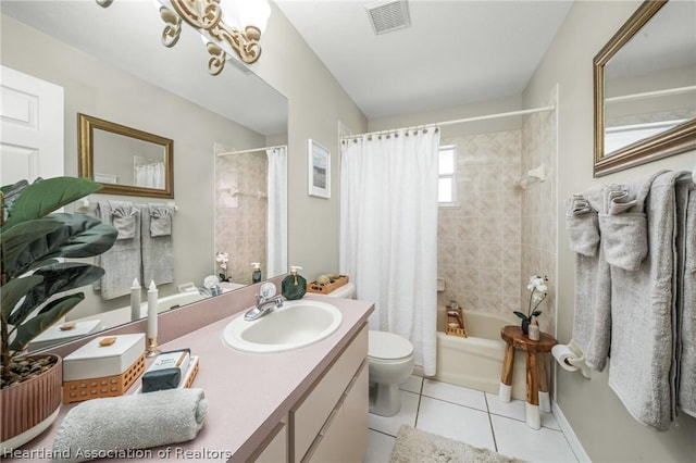 full bathroom with tile patterned flooring, a notable chandelier, toilet, shower / tub combo with curtain, and vanity