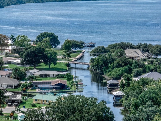 birds eye view of property featuring a water view