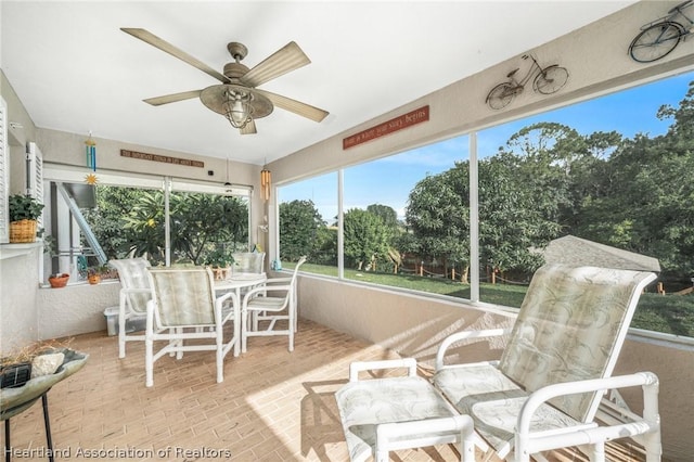 sunroom / solarium with ceiling fan