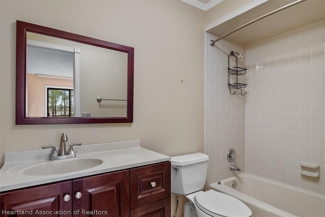 full bathroom featuring toilet, vanity, and tiled shower / bath