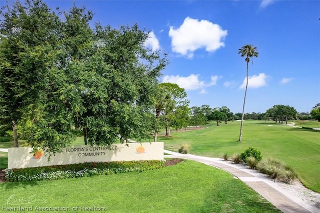 view of home's community with a yard