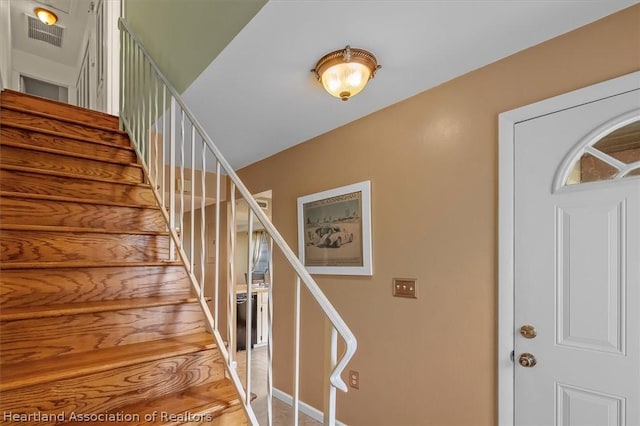 staircase featuring hardwood / wood-style floors