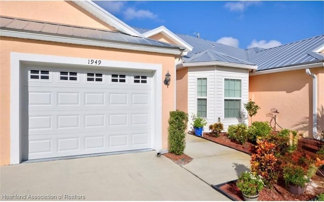 doorway to property featuring a garage