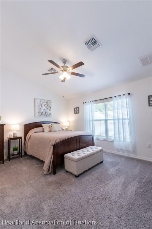 carpeted bedroom with ceiling fan and lofted ceiling