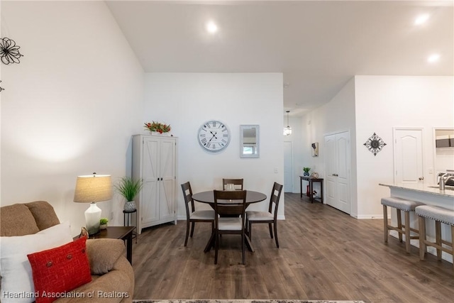 dining area with dark hardwood / wood-style floors