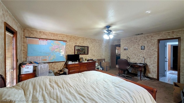 tiled bedroom with ceiling fan