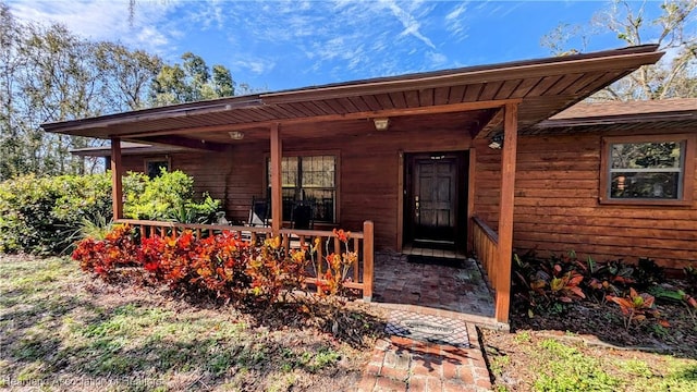 doorway to property with covered porch