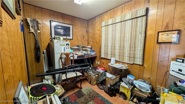 miscellaneous room featuring wooden walls