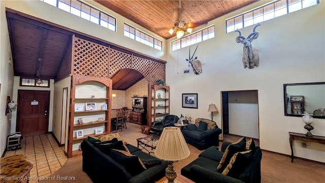 carpeted living room with a high ceiling and wood ceiling