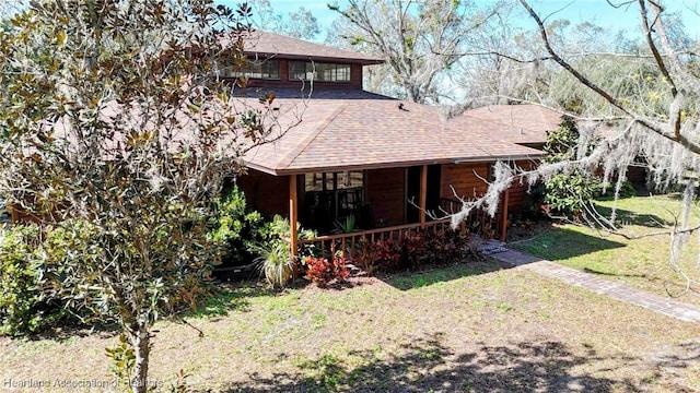 rear view of house with a lawn