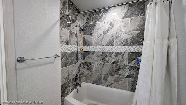 bathroom featuring shower / bath combo with shower curtain