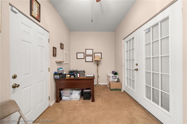 office with baseboards, light carpet, and french doors