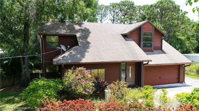 751 Grenada St, Port St Lucie, FL 34983 - chalet / cabin with a shingled roof and driveway
