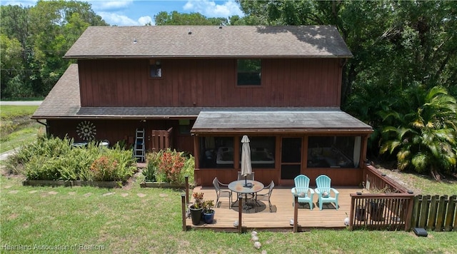 751 Grenada St, Port St Lucie, FL 34983 - back of house with a deck, a lawn, roof with shingles, and outdoor dining area