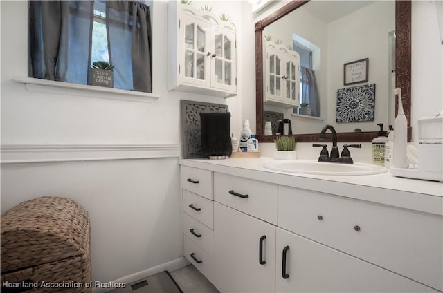 751 Grenada St, Port St Lucie, FL 34983 - bathroom with vanity, baseboards, and tile patterned flooring