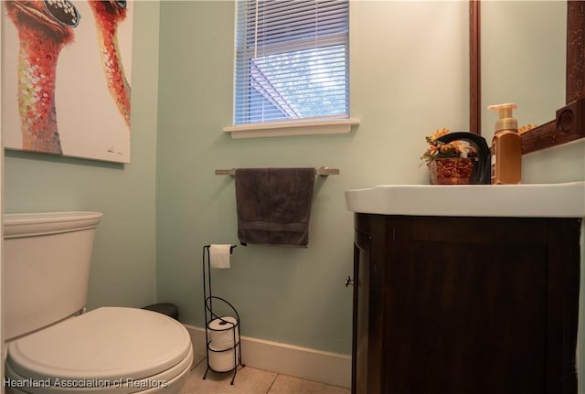 751 Grenada St, Port St Lucie, FL 34983 - bathroom with vanity, baseboards, tile patterned floors, and toilet