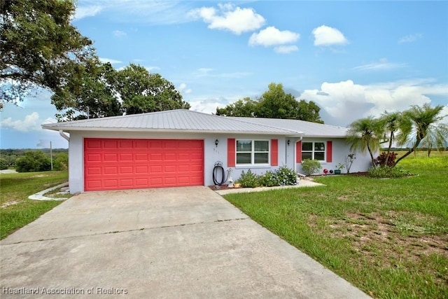 ranch-style house with a garage and a front yard