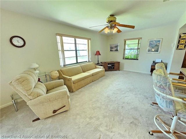 living room with ceiling fan and light carpet