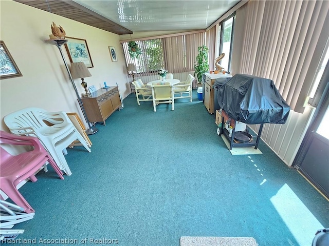 sunroom featuring lofted ceiling