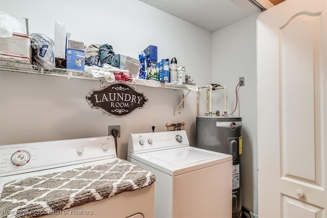 laundry area featuring laundry area, separate washer and dryer, and electric water heater