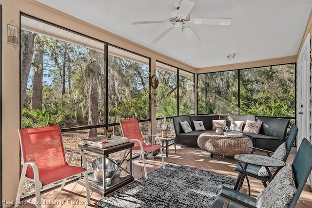 sunroom / solarium with plenty of natural light and ceiling fan