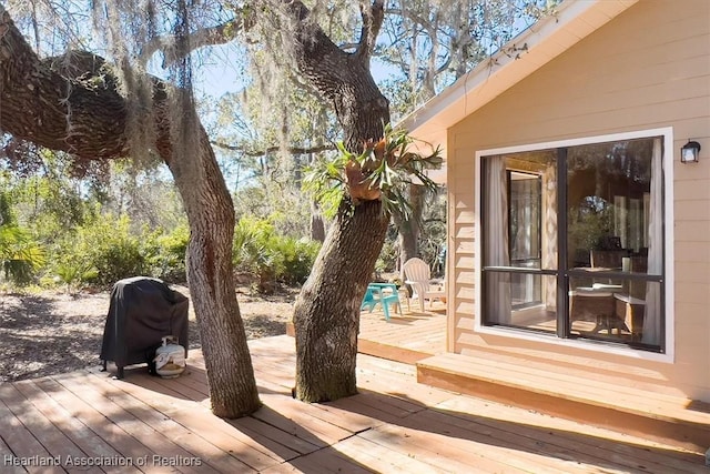 deck featuring a grill