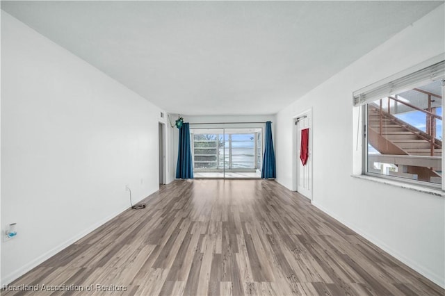 empty room with wood-type flooring