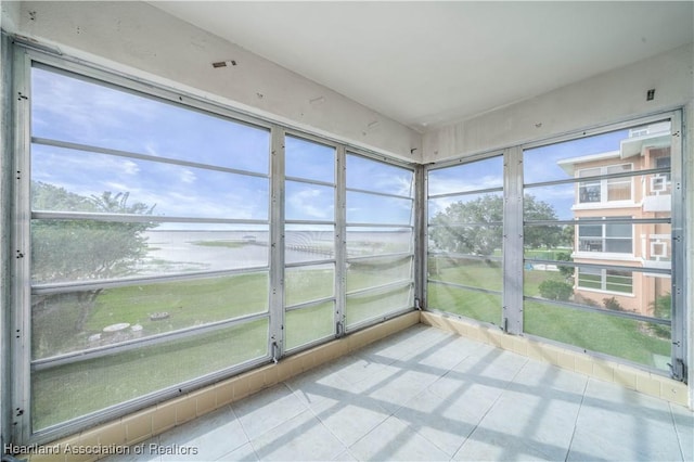 unfurnished sunroom featuring a wealth of natural light