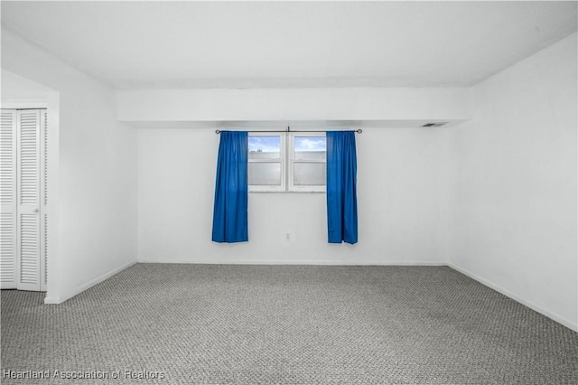 spare room with carpet flooring