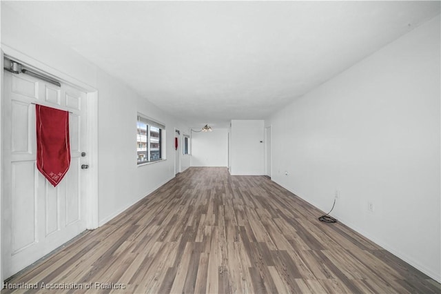 unfurnished room featuring hardwood / wood-style floors