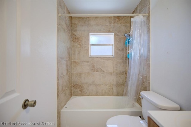 bathroom featuring vanity, toilet, and shower / bath combination with curtain