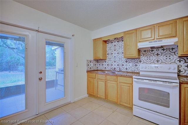 kitchen with decorative backsplash, white electric range, under cabinet range hood, a sink, and light tile patterned floors