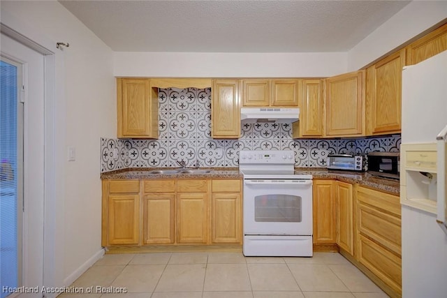 kitchen with a toaster, white appliances, under cabinet range hood, a sink, and backsplash