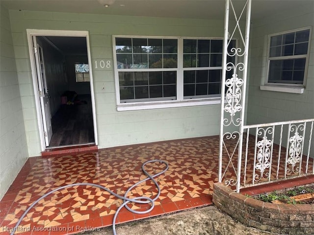 doorway to property with a porch