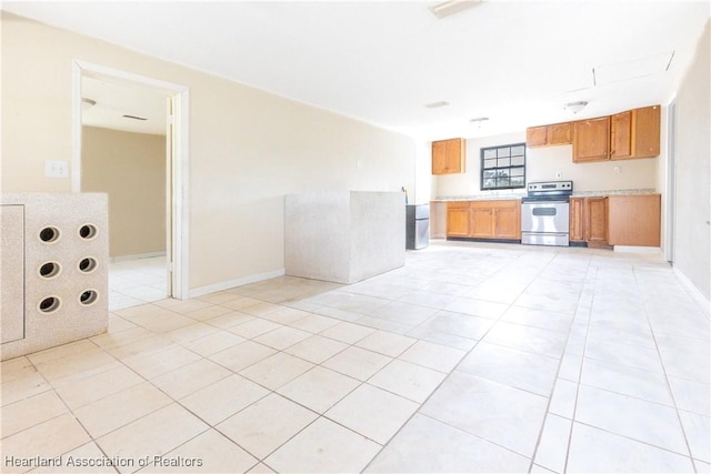 kitchen featuring light tile patterned flooring and stainless steel electric stove