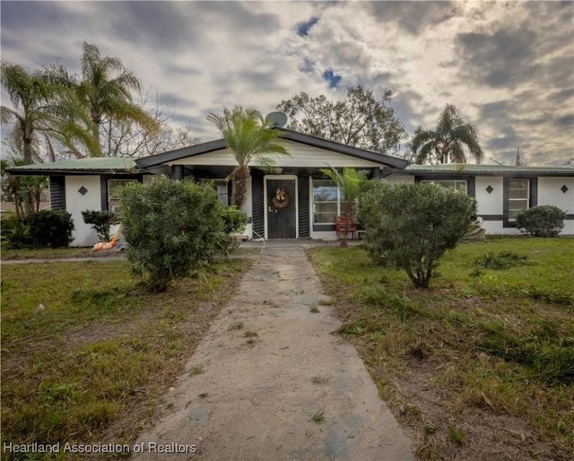 view of front of home with a front yard