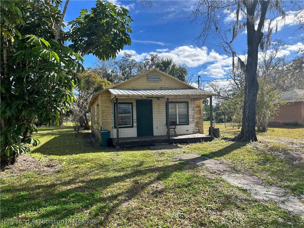 bungalow featuring a front yard and a porch