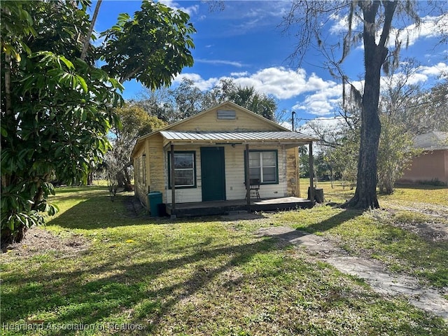 bungalow featuring a front yard and a porch