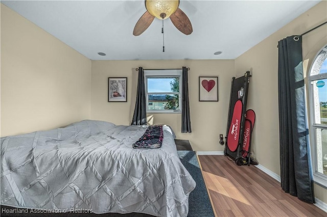 bedroom with ceiling fan and hardwood / wood-style floors