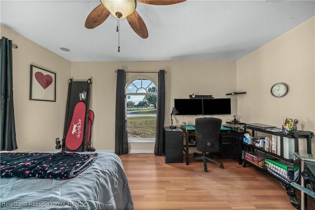 bedroom with ceiling fan and hardwood / wood-style flooring