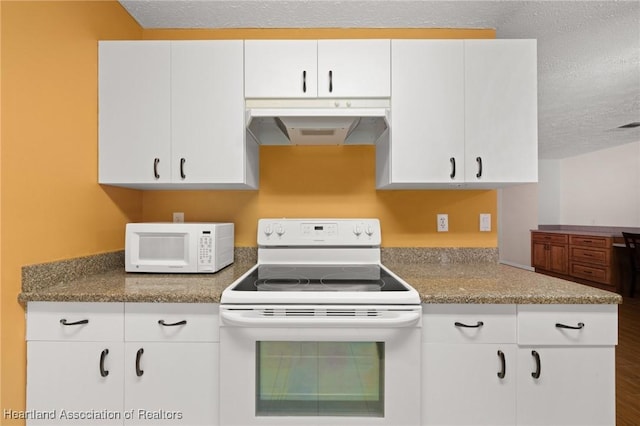 5808 Twisted Oaks Dr, Sebring, FL 33876 - kitchen featuring white appliances, under cabinet range hood, a textured ceiling, white cabinets, and wood finished floors