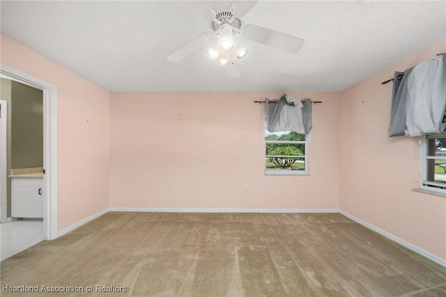 5808 Twisted Oaks Dr, Sebring, FL 33876 - carpeted empty room featuring a ceiling fan, healthy amount of natural light, and baseboards