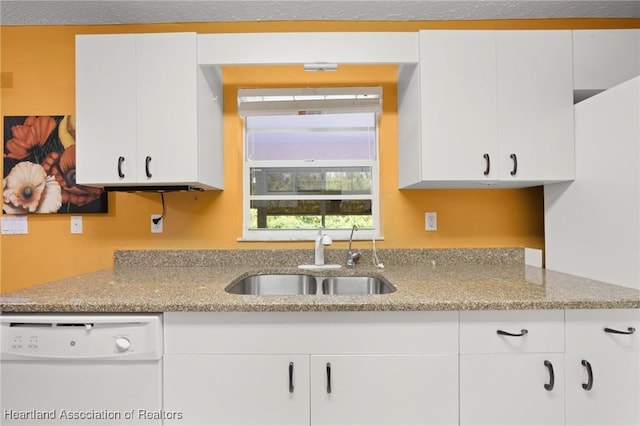 5808 Twisted Oaks Dr, Sebring, FL 33876 - kitchen featuring dishwasher, a sink, light stone counters, and white cabinets