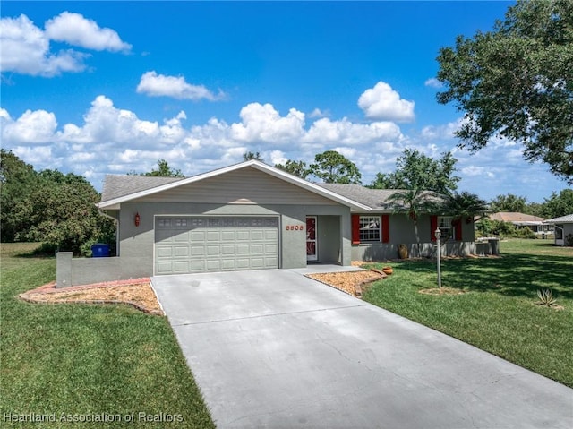5808 Twisted Oaks Dr, Sebring, FL 33876 - ranch-style house with an attached garage, a front yard, concrete driveway, and stucco siding