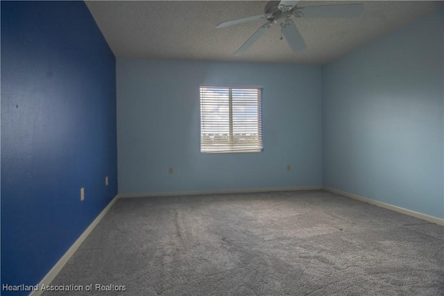 carpeted bedroom with ceiling fan and a textured ceiling