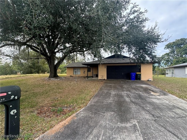 ranch-style house with a garage and a front lawn